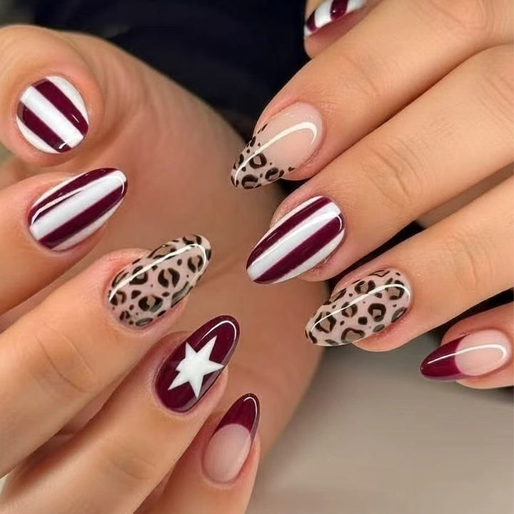 Artful stiletto nails with leopard pattern and elegant glitter decoration Stornfield