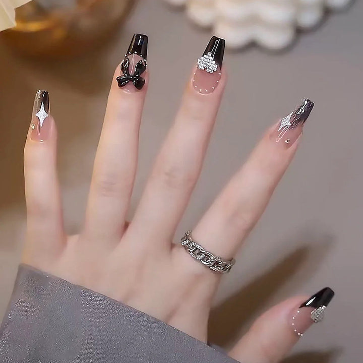 Acrylic nail set with glamorous 3D decorations and noble accents Stornfield