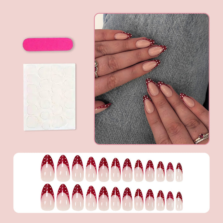 Nail art set with elegant red tips and playful dots Stornfield