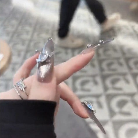 Glamorous artificial nails with rhinestone accents Stornfield