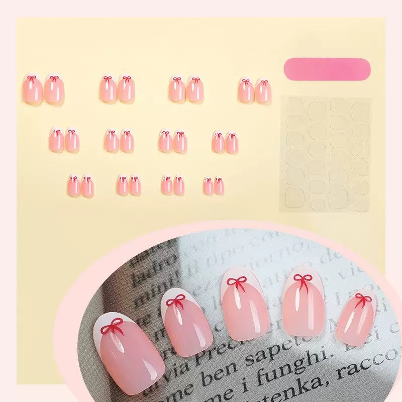 Artificial nail set with elegant bows and French tips Stornfield