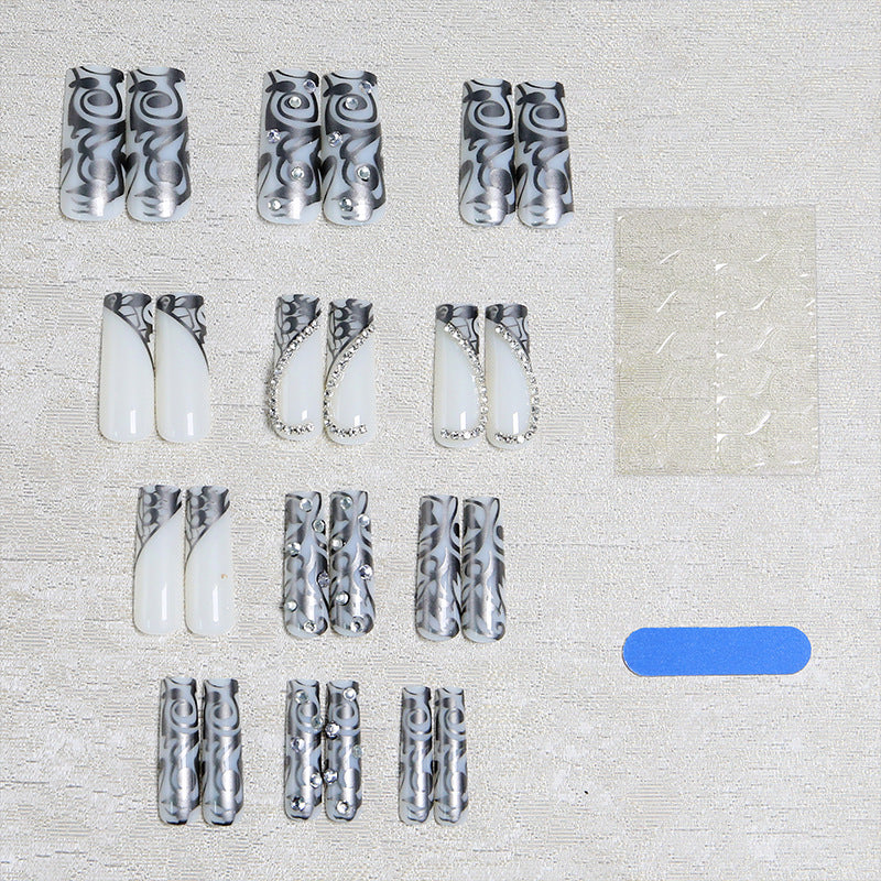 Acrylic nail set with elegant patterns and sparkling accents Stornfield