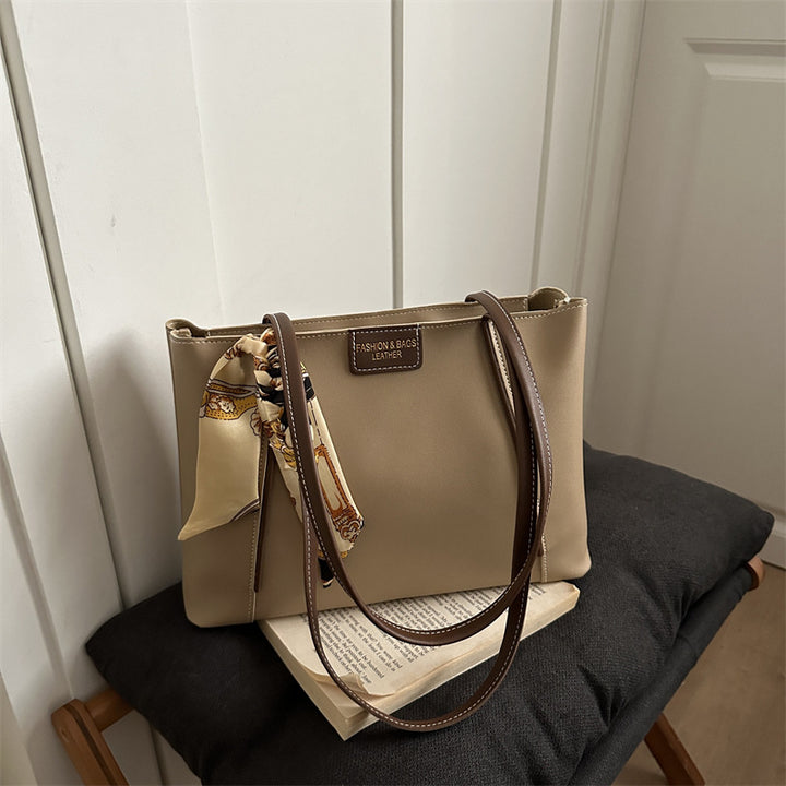 Elegant Leather Tote Bag with Decorative Scarf