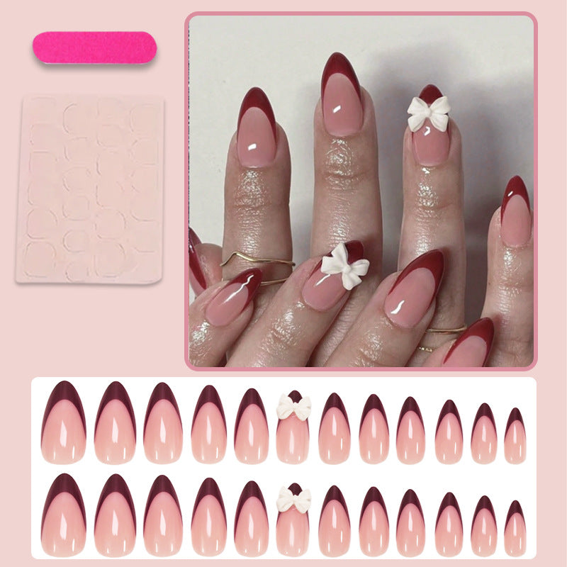 Acrylic nail set with elegant lace design and romantic bows Stornfield