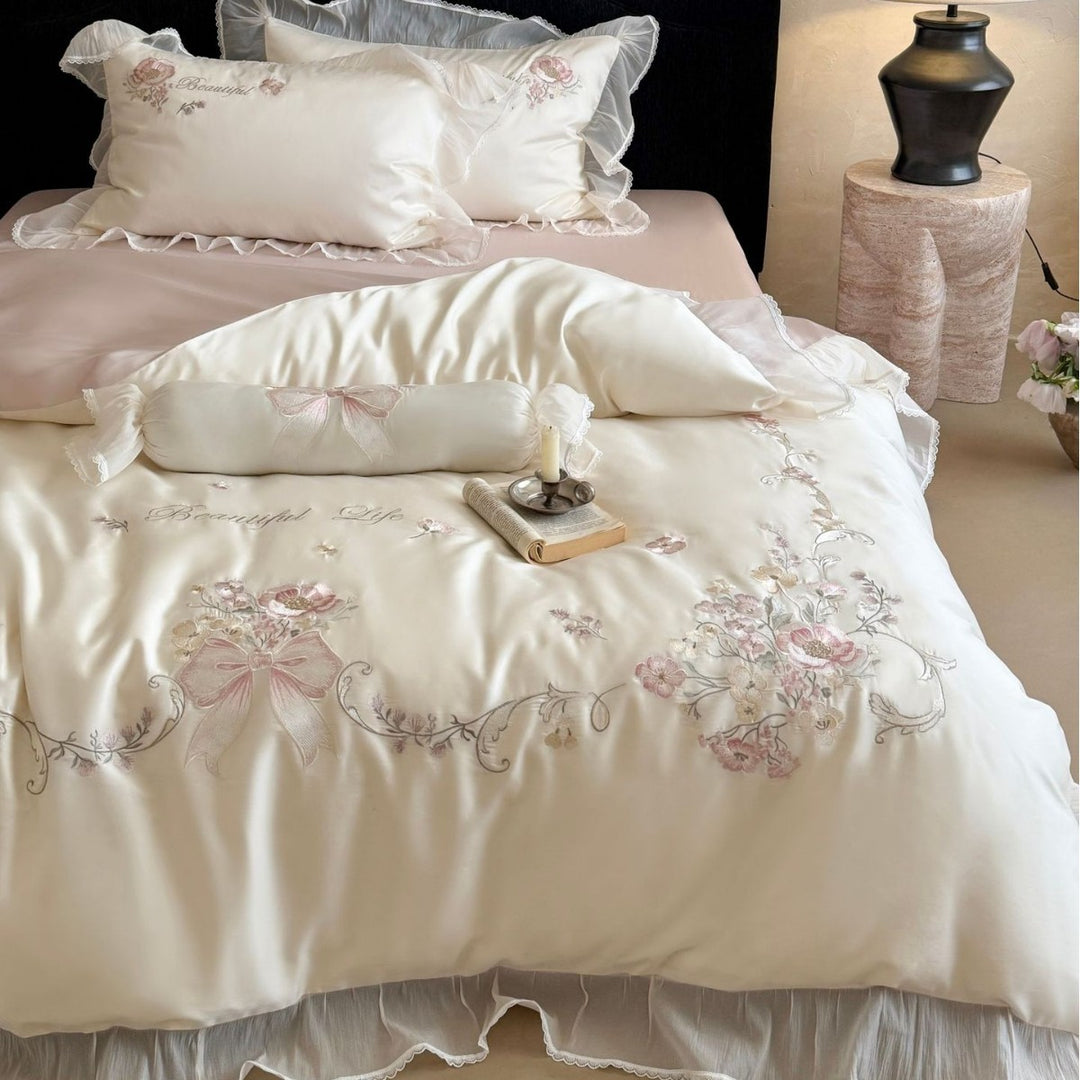 Embroidered satin bedding set with frill, ruffles, and decorative pillow