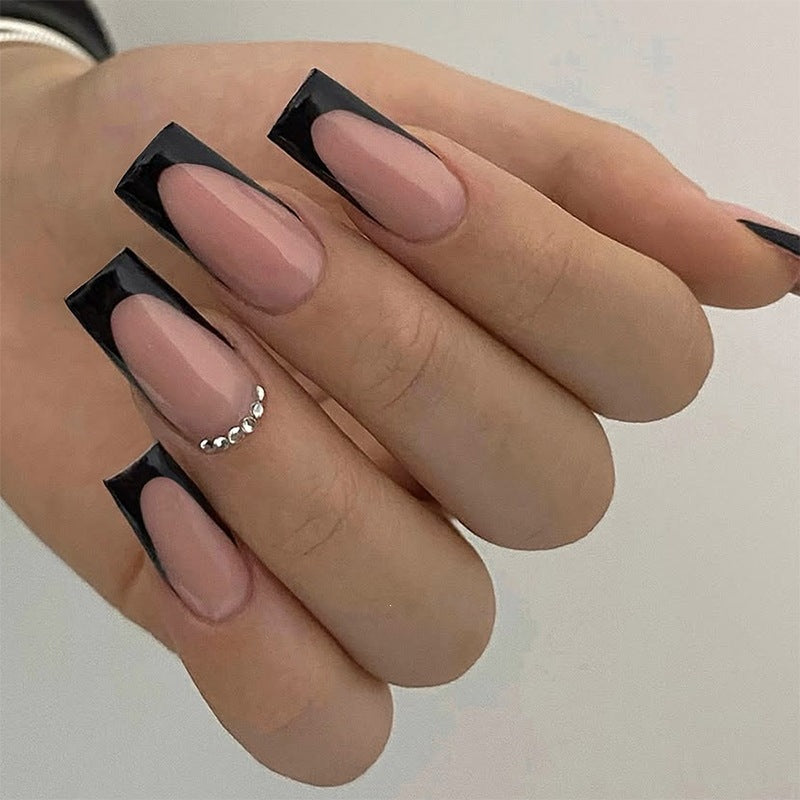 Nail set with elegant black and white colors and glitter accents Stornfield