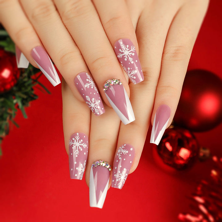 Artistic Nail Extensions with Snowflake Design and Glitter Accents Stornfield