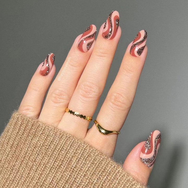 Artful nail extensions with an elegant leaf pattern Stornfield