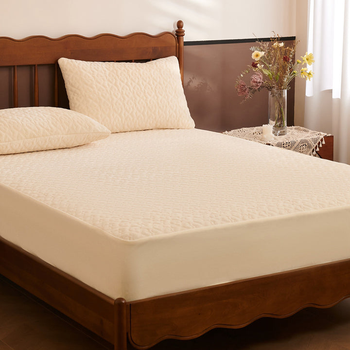 Quilted mattress protector with non-slip bottom and soft microfiber cover