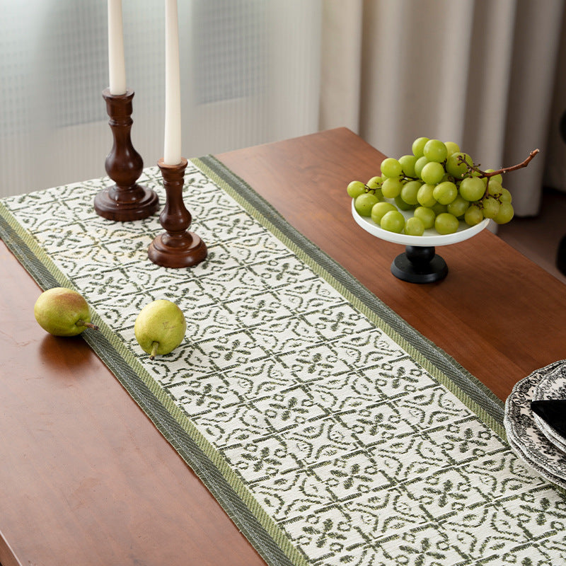 Decorative table runner with woven ornament jacquard and finely hemmed edges Stornfield