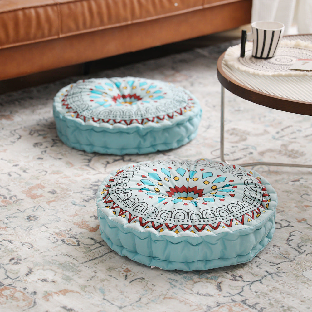 Round floor cushion with medal print, carrying handle and quilted padding