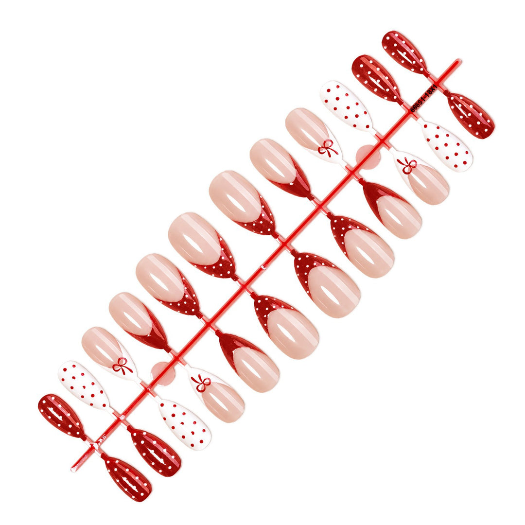 Nail set with elegant bows and polka dots Stornfield