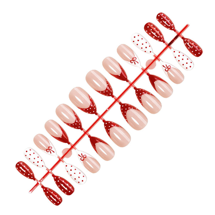 Nail set with elegant bows and polka dots Stornfield