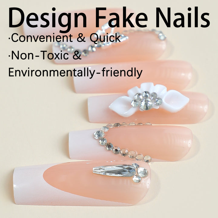 Artificial nail set with elegant French tips and glamorous embellishments Stornfield