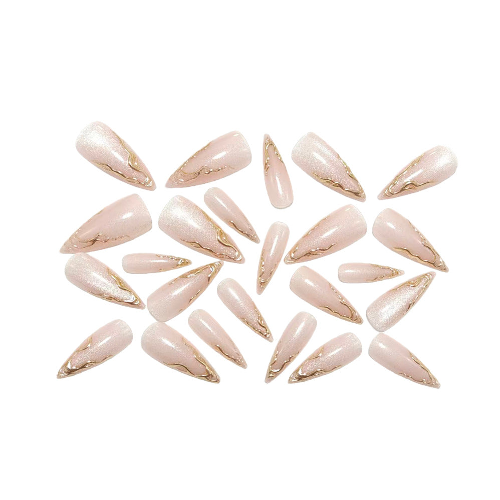 Artificial nails in elegant stiletto design with golden accents Stornfield