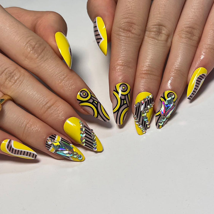 Artful nail extensions with geometric design and glitter accents Stornfield