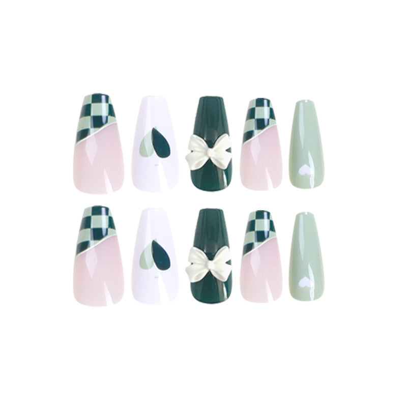 Artificial nail extensions with creative design and glitter accents Stornfield