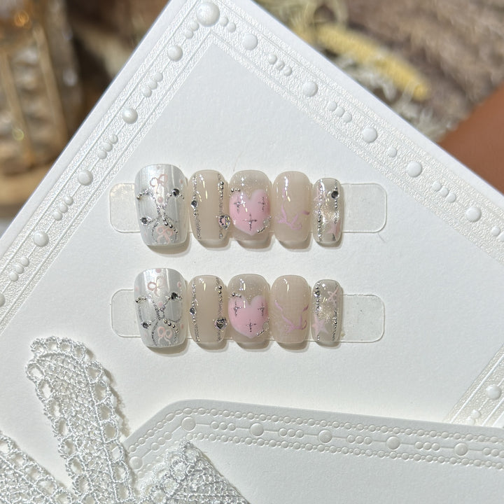 Decorative Press-On Nail Set with Heart and Silver Accents Stornfield