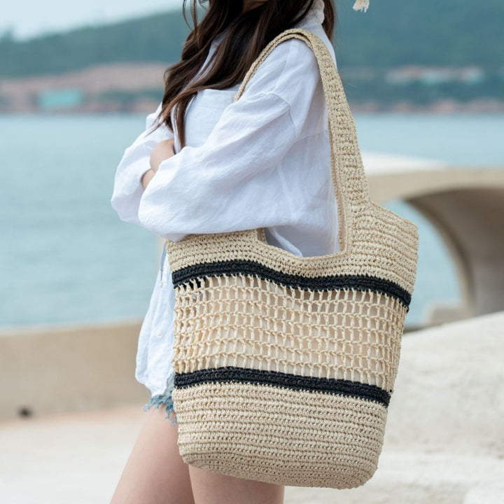 Woven natural material handbag with elegant structure Stornfield