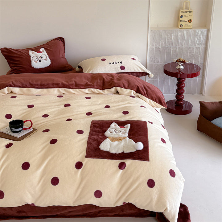 Plush bedding set with embroidered dog motif and striped cuddle blanket