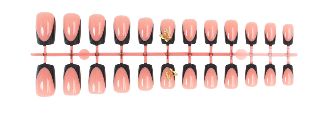 Artificial nails with elegant black and white tips and delicate accents Stornfield