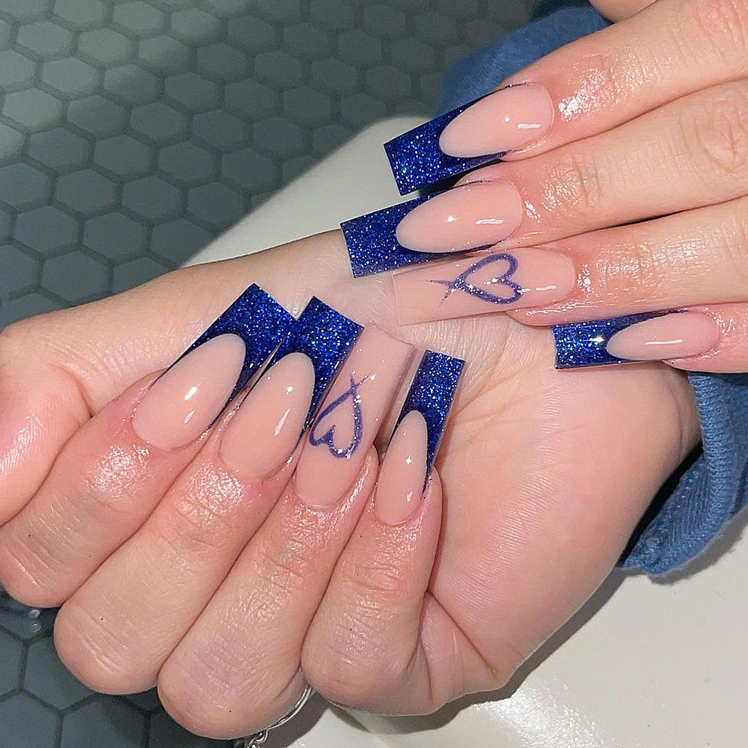 Artificial nails with glitter accents and unique heart design Stornfield