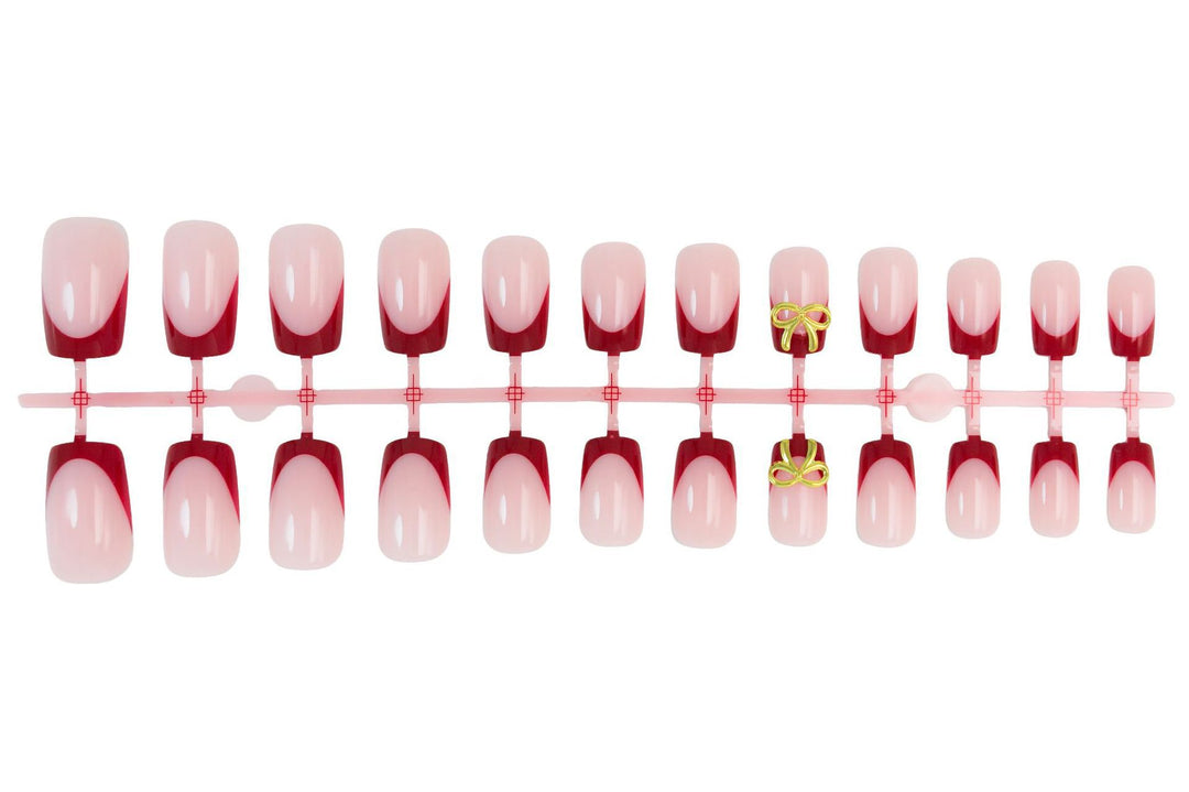 Artificial nail set with elegant red tips and refined bow decorations Stornfield