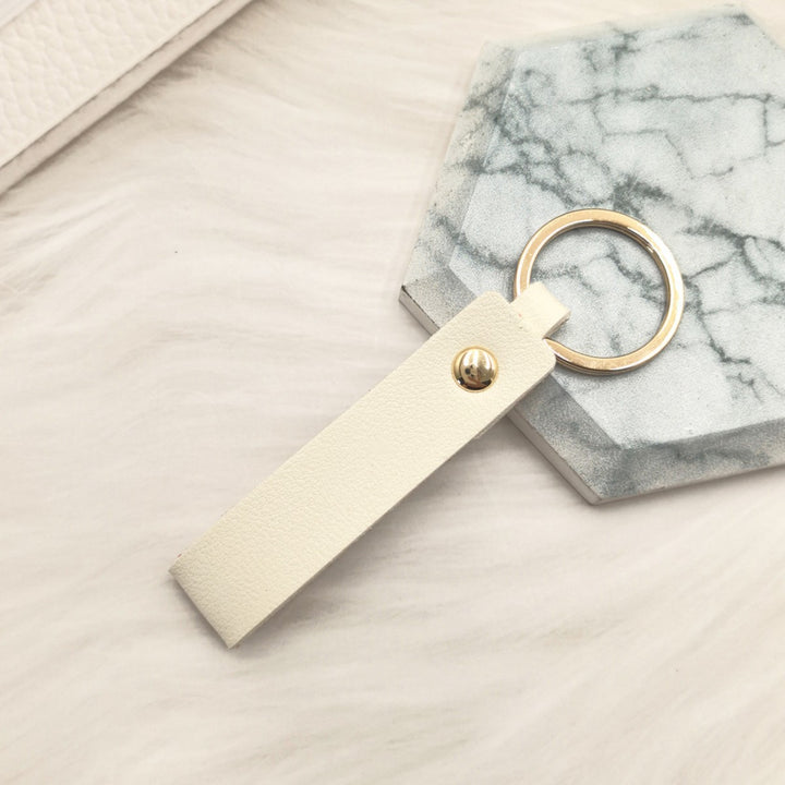 Unisex keychain made of high-quality synthetic leather with elegant metal embellishment Kalsten