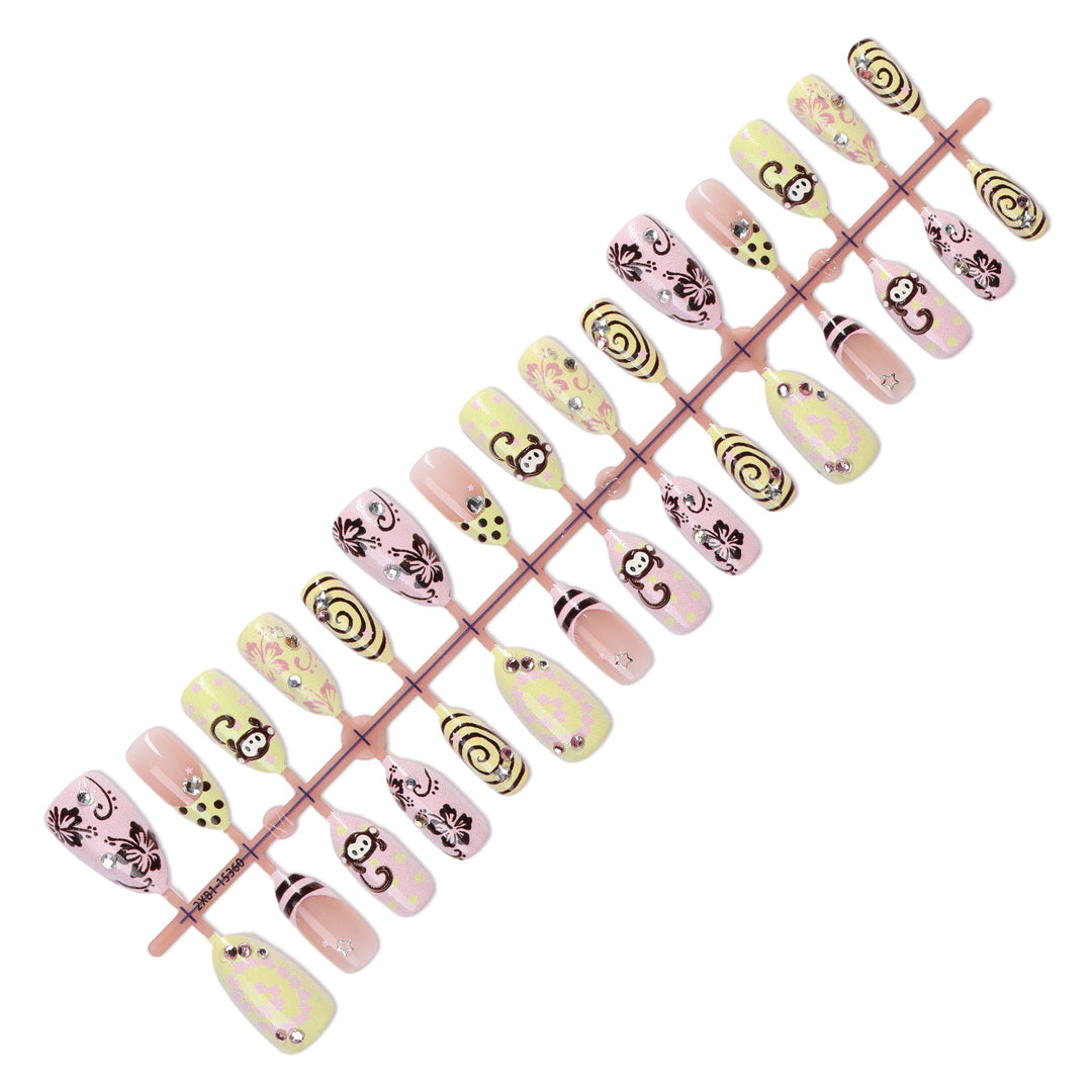 Creative nail art set with playful monkey designs and glitter details Stornfield