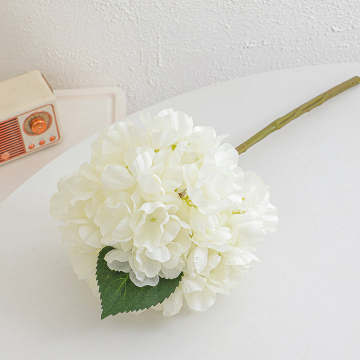 Artificial flower branch with realistic flowers