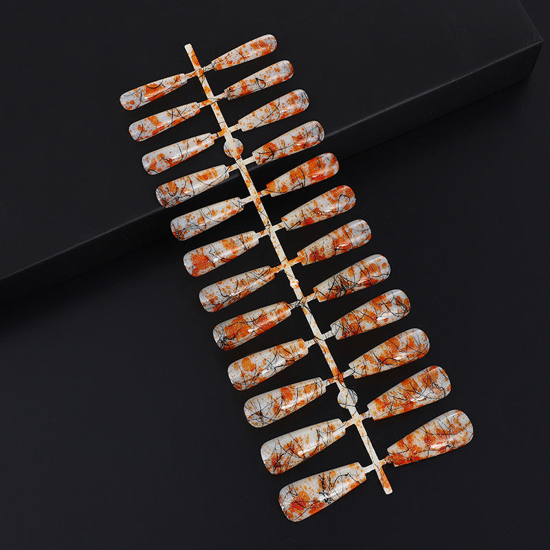 Creative nail art with blood splatter design Stornfield