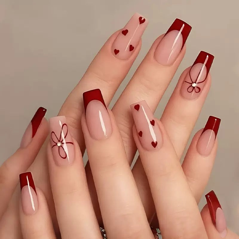Artificial nail set with romantic heart and bow motifs Stornfield