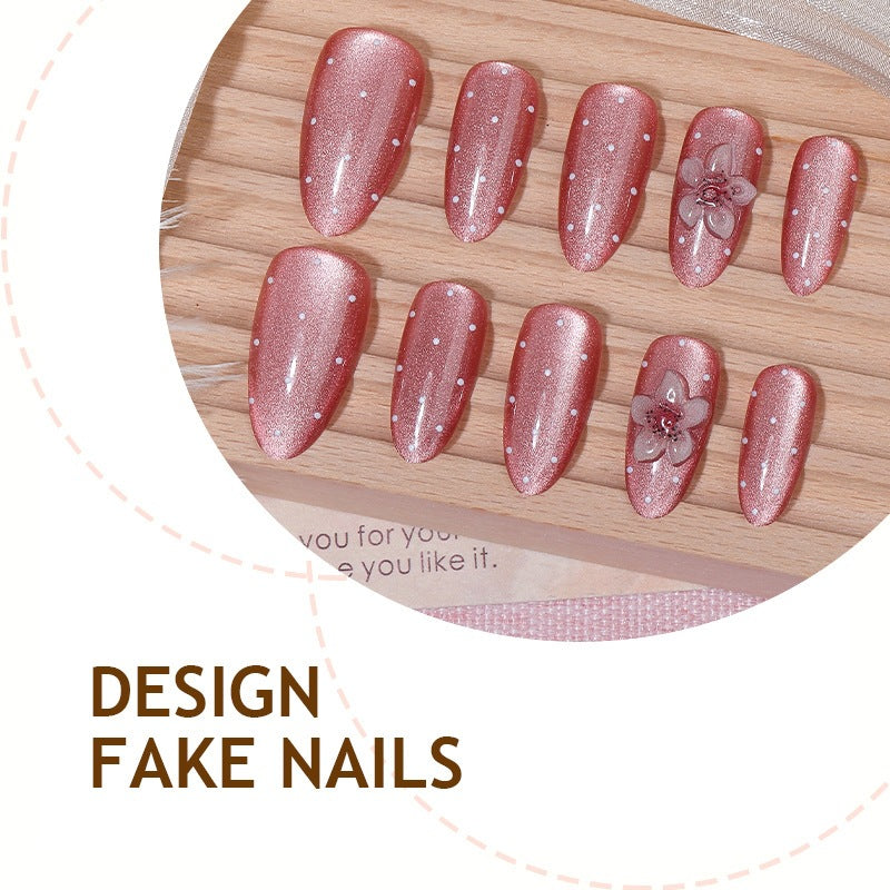 Artificial nail set with glamorous glitter design and floral accent Stornfield