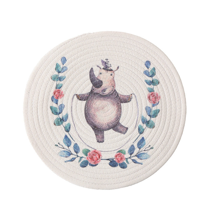 Round quilted table set placemat made of cotton blend with playful rhinoceros print
