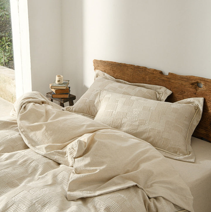 Vintage-inspired linen bedding set with subtle floral damask & ruffle