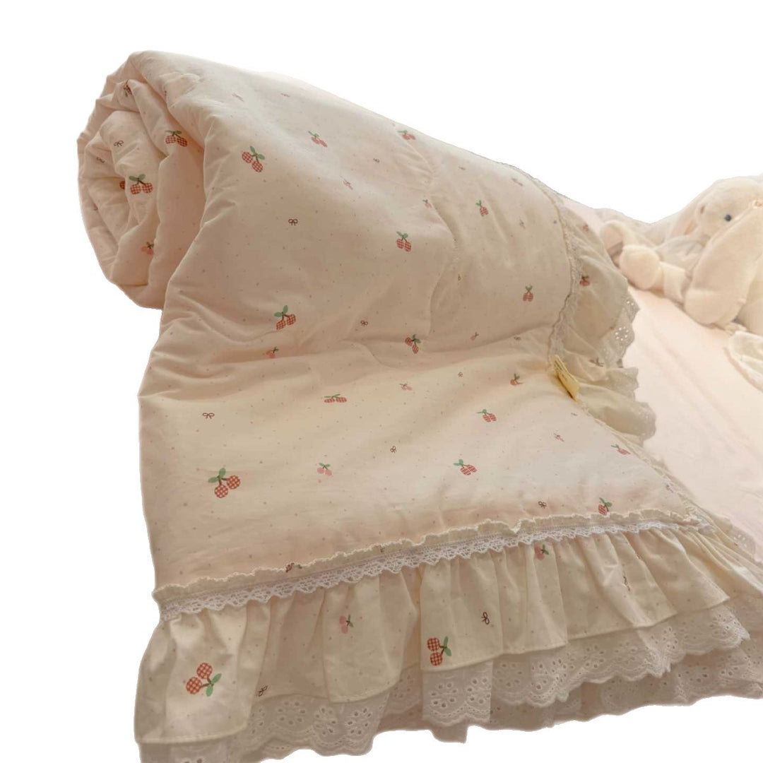 Quilted bedspread with ruffle and lace trim made of cotton blend