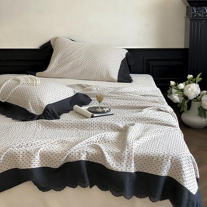 Quilted bedspread and pillowcase set with waffle texture and contrasting ruffle