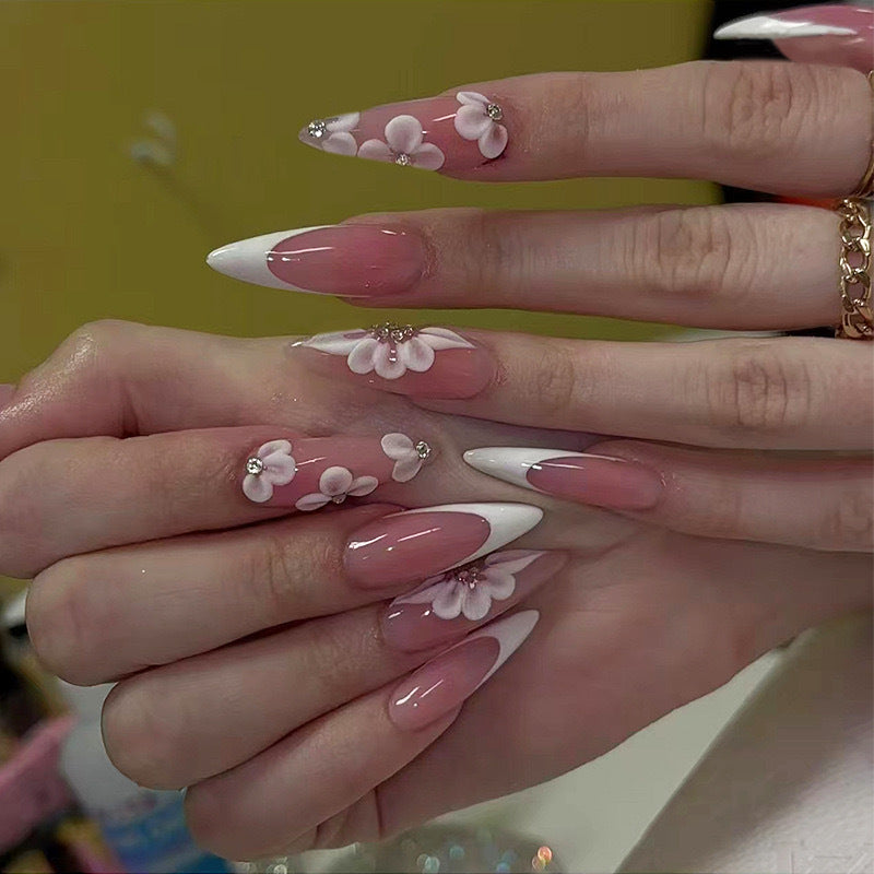 Elegant artificial nail set with floral design and glitter accents Stornfield