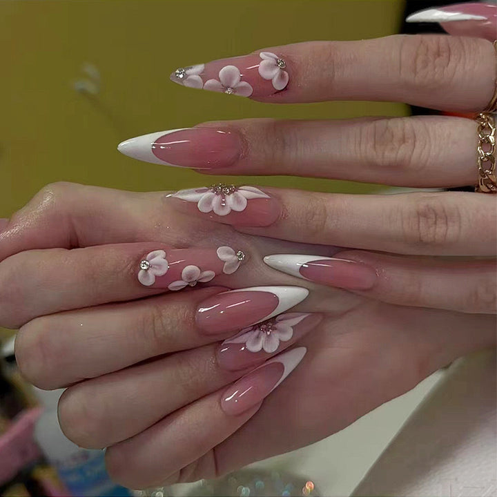 Elegant artificial nail set with floral design and glitter accents Stornfield