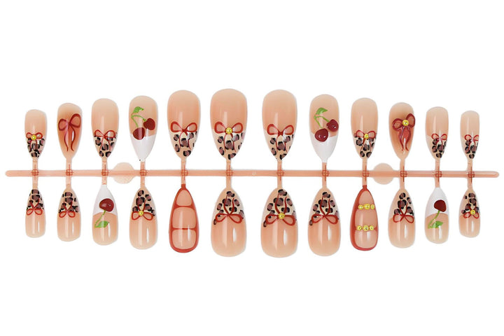 Artificial nail set with creative ribbon and fruit designs Stornfield