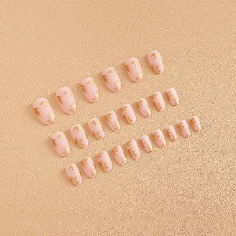 Artificial nail set with elegant gold leaf design Stornfield