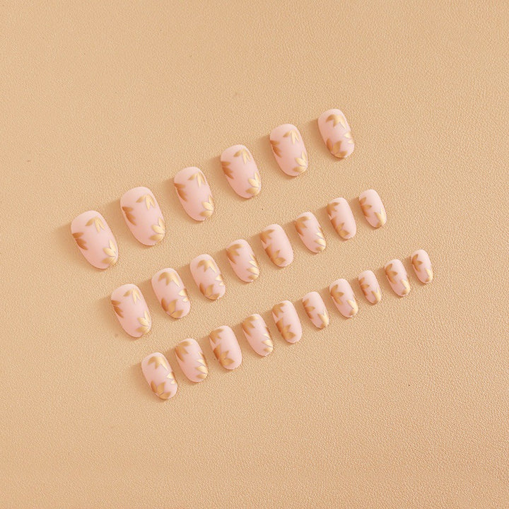 Artificial nail set with elegant gold leaf design Stornfield