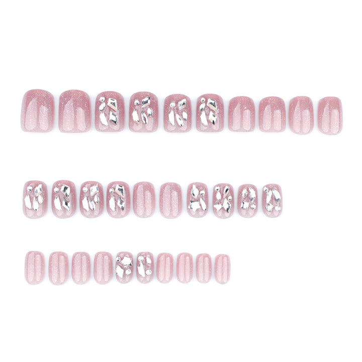 Artificial nail art with glamorous glitter accents Stornfield