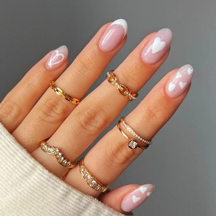 Elegant artificial nails with hearts and glitter Stornfield