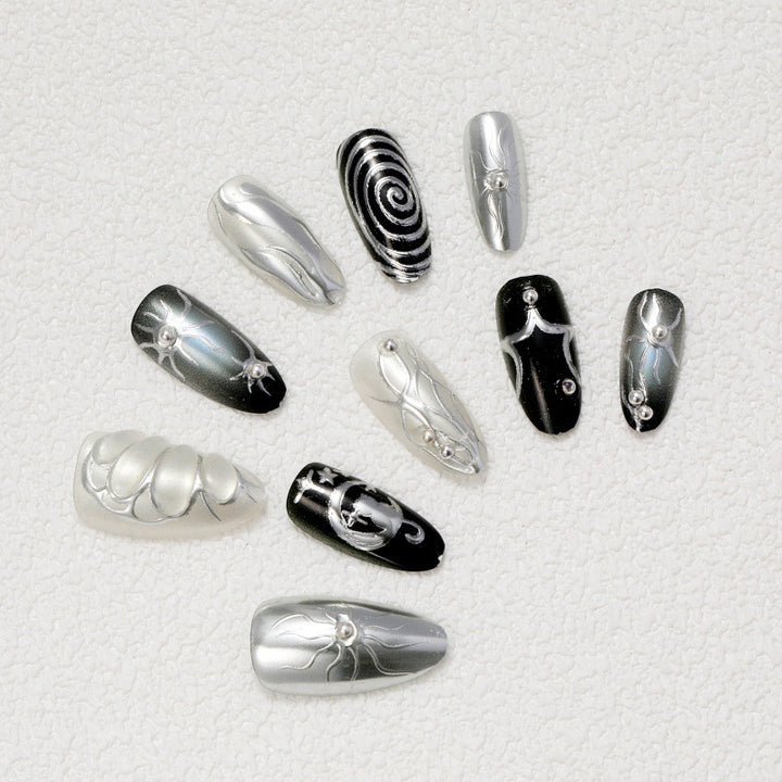 Artificial nails with metallic effects and complex designs Stornfield