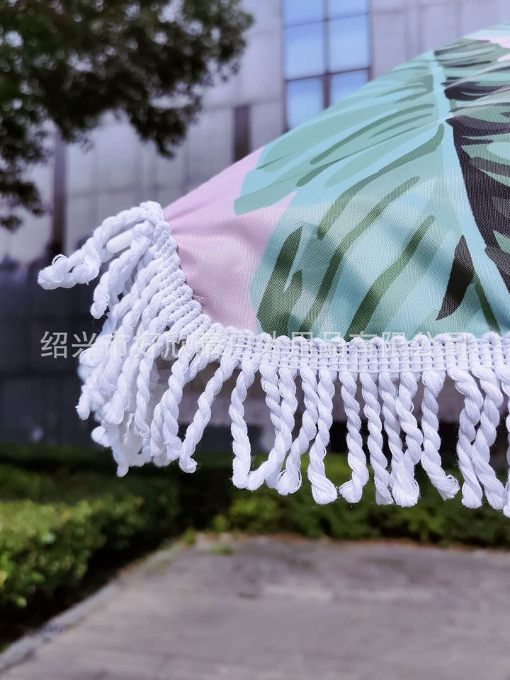 Ladies sun umbrella with tropical leaf design and tassel decoration Stornfield