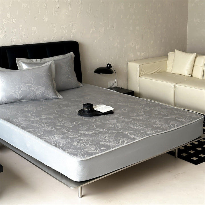 high-quality non-slip mattress protector with integrated fitted sheet and elegant jacquard pattern