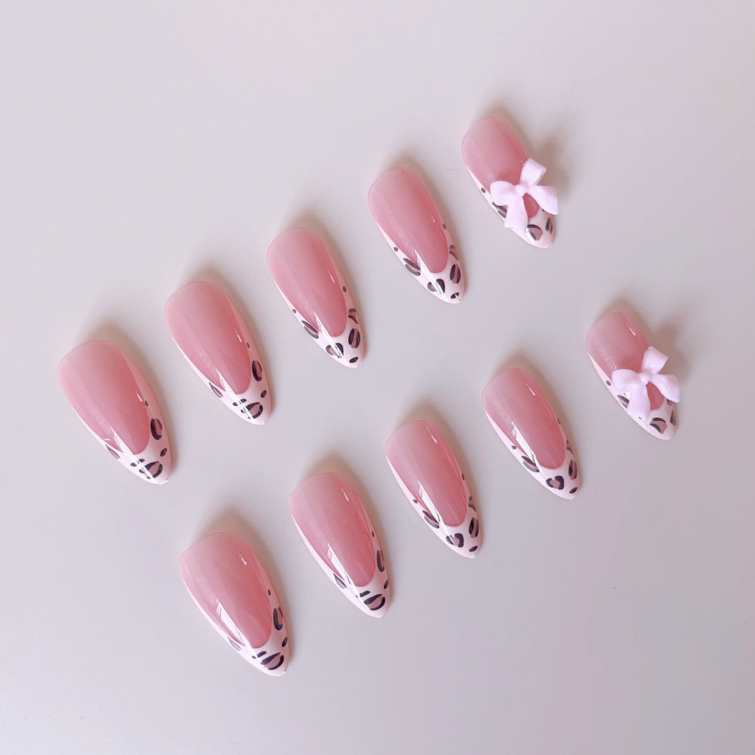 Acrylic nail set with leopard pattern and decorative bows Stornfield