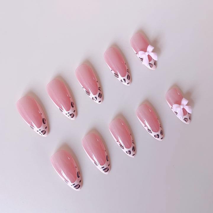 Acrylic nail set with leopard pattern and decorative bows Stornfield