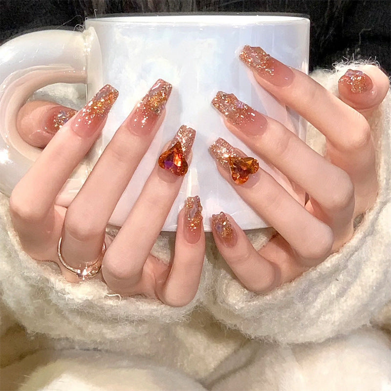 Artificial nail set with glitter and heart accents Stornfield